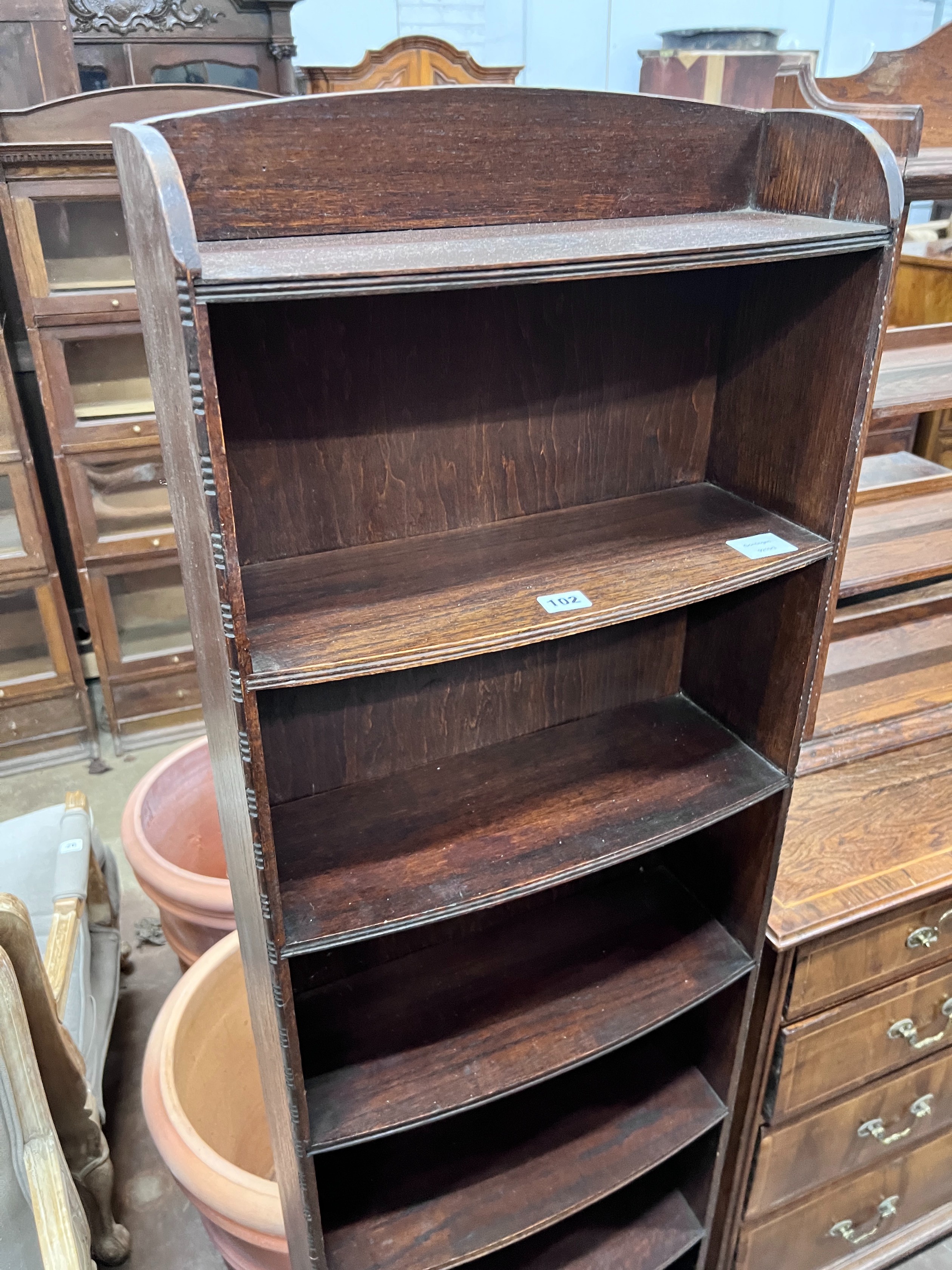 A 1920's oak narrow eight shelf open bookcase, width 49cm, depth 30cm, height 161cm *Please note the sale commences at 9am.